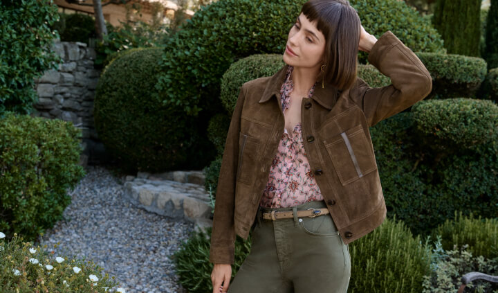 Model standing wearing suede Jacket