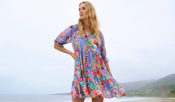 Model wearing printed floral mini dress