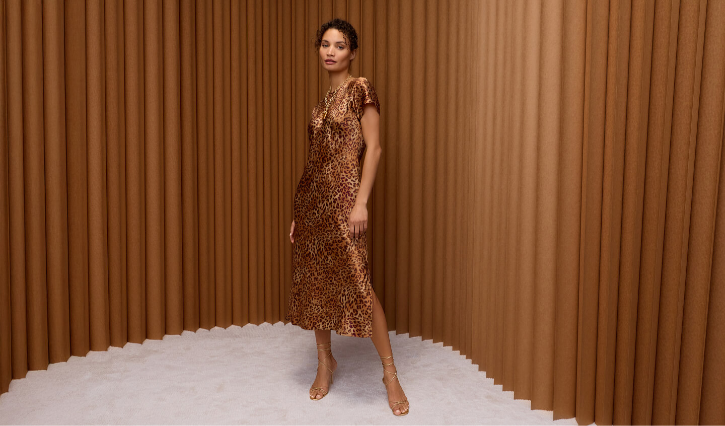 Model wearing leopard print midi dress