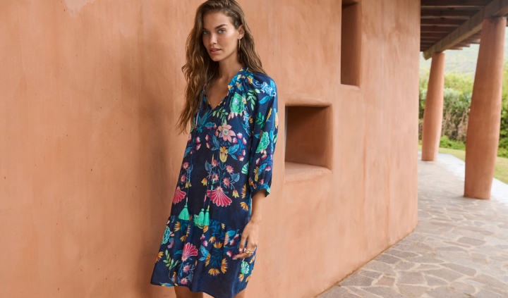 Model wearing printed blue dress