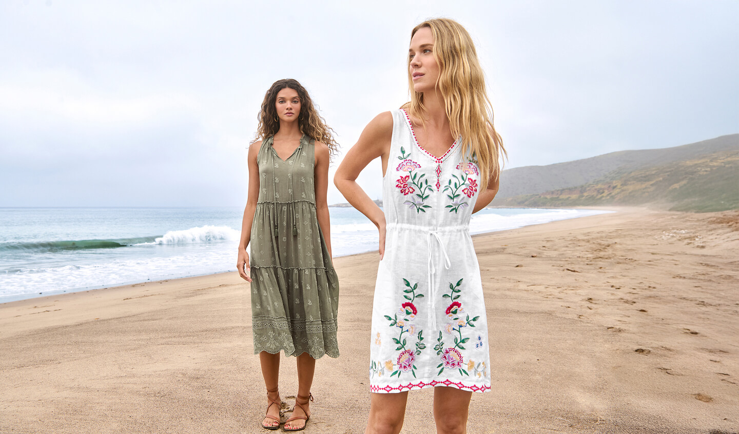 Models wearing embroidered dresses